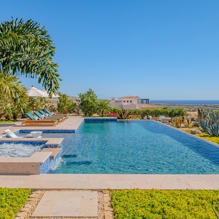 Dive into crystal-clear waters while soaking up stunning ocean views from this infinity pool paradise.