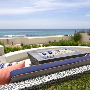Patio with firepit and an beachfront view