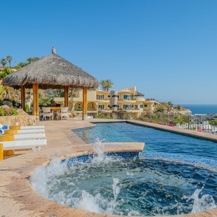 Unwind by your private pool with bubbling spa jets while taking in stunning ocean views from this hillside paradise.