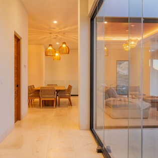 Step into your bright, modern haven where warm wood accents and sleek glass create the perfect balance of comfort and style.