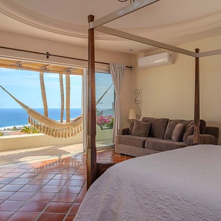 Wake up to stunning ocean views from your spacious suite, where the balcony hammock and private terrace invite you to unwind in pure coastal serenity.