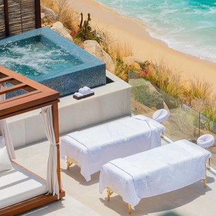 Outdoor spa level with beach view
