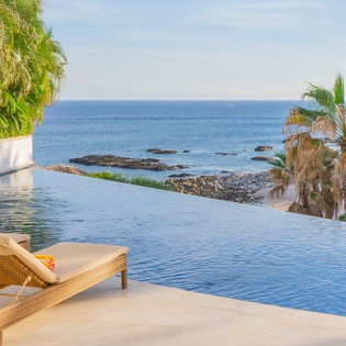 Poolside with beachfront views