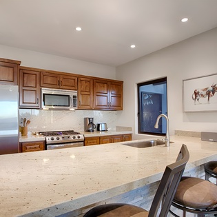 Fully equipped kitchen with bar seating