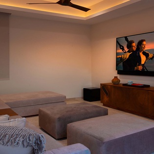 Settle into your private lounge with plush seating and ambient lighting—the perfect spot to unwind after a day of exploring.