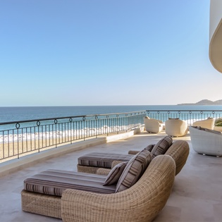 Patio with beachfront and ocean views
