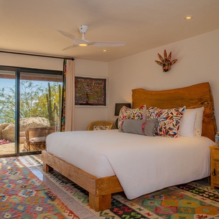 Wake up to ocean views through your private terrace doors in this beautifully appointed bedroom with handcrafted furnishings and vibrant local textiles.
