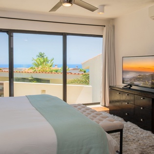 Bedroom suite with terrace access and ocean view