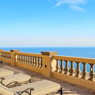 Ocean view patio with lounge chairs