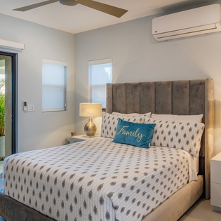 Sink into your luxurious bed with soft linens and warm bedside lighting for the perfect night's rest.