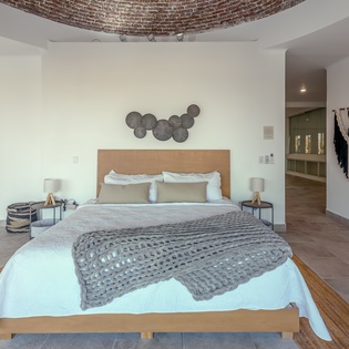 Bedroom suite with terrace access and views