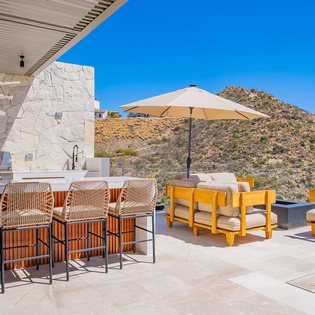 Relax in style on this stunning outdoor terrace, where mountain views frame your morning coffee and afternoon lounging moments.