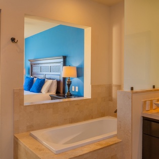 En-suite bathroom with bathtub
