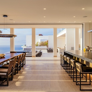 Fully equipped kitchen and dining area with ocean views