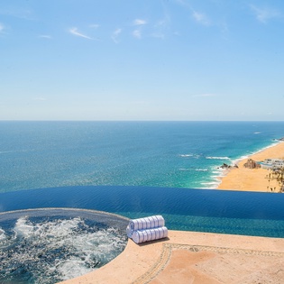 Jacuzzi and infinity pool overlooking beachfront views