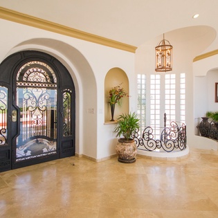 Entrance with classic arched entry and beautiful floors