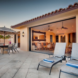 Relax on your private terrace as the sun sets, then gather around the outdoor dining table or unwind on lounge chairs before stepping inside to a welcoming open-plan living space.