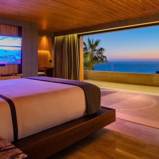 Bedroom suite with terrace access and ocean view