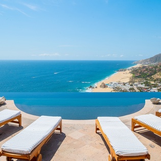 Lounge poolside with gorgeous beach front views