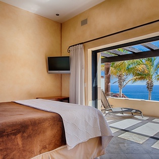Wake to sunlight streaming through your private terrace doors, where palm trees frame endless ocean views and gentle sea breezes invite you to unwind in paradise.