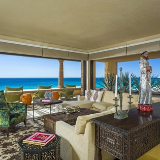 Relax in your oceanfront living room where panoramic sea views and luxurious furnishings create the perfect beachside retreat.