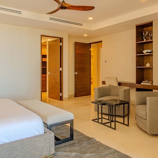 Relax in your elegantly furnished suite with plush seating, modern décor, and climate-controlled comfort, offering a perfect blend of style and tranquility for your stay.