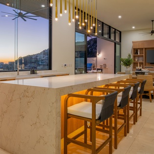 Cook with stunning mountain views from your sleek marble kitchen island, complete with modern bar seating for memorable meals.