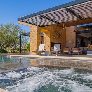 Poolside with view of villa