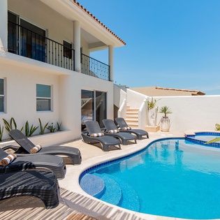 Inviting outdoor terrace with swimming pool, jacuzzi and patio furniture