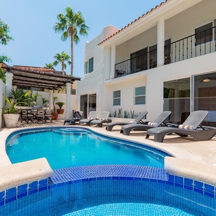 Inviting outdoor terrace with swimming pool, jacuzzi and patio furniture