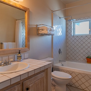 En suite bathroom with bath tub