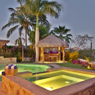 Jacuzzi and pool during evening
