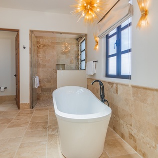 En suite bathroom with bath tub