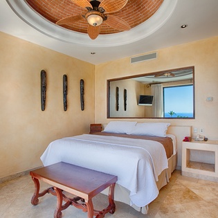 Slip into crisp white linens and drift off beneath a tropical ceiling fan while ocean breezes whisper through your window. Your serene retreat features handcrafted details and views that wake you to paradise daily.