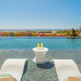 Cool off in your private infinity pool with refreshing drinks and stunning panoramic views stretching to the horizon.