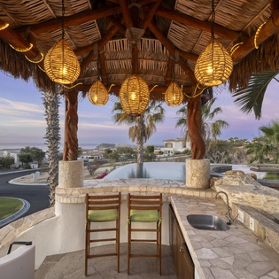 Bar seating under palapa