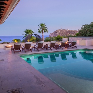 Poolside with ocean views at dusk