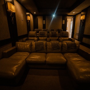 Sink into plush leather recliners in your private home theater, where movie nights become unforgettable experiences with cinema-quality projection and surround sound.