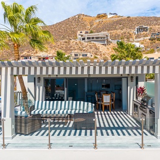 Your private poolside pavilion features shaded dining and grilling space, perfect for cooking while staying cool in the tropical breeze.