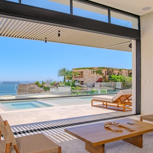 Relax in your private open-plan living space with stunning ocean views and direct pool access.