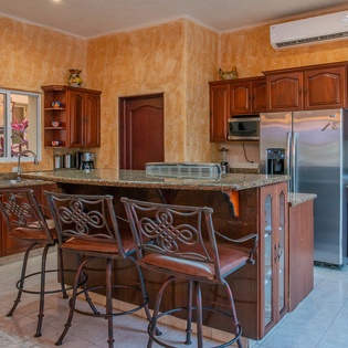 Fully equipped kitchen with seating bar