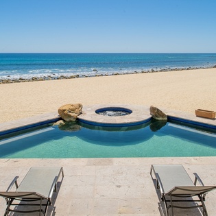 Enjoy the gorgeous day by the pool with beachfront views