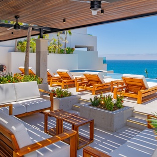 Unwind on your private terrace with stunning ocean views, where luxury teak loungers await your arrival.