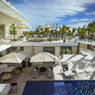 Patio with sunny pool and lounge