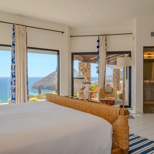 Wake up to stunning ocean views from your comfortable bed, with tropical details and sea breezes flowing through open windows.