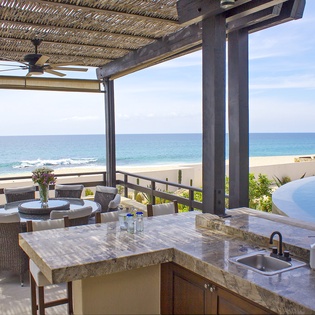 Outdoor dining with beachfront view