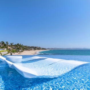 Poolside with incredible beachfront views