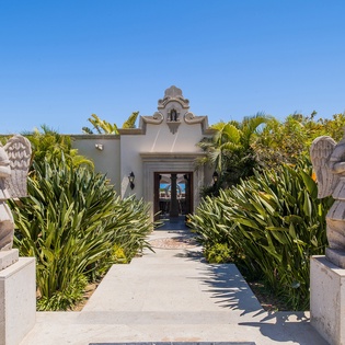 Exterior entrance of villa with statues