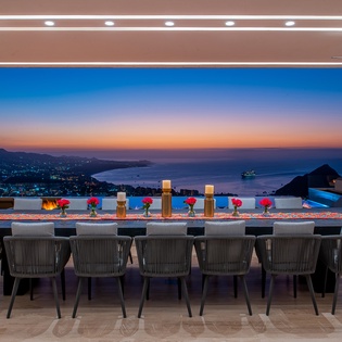 Outdoor dining with sunset ocean views