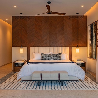 Slip into this beautifully designed bedroom where modern comfort meets warm elegance. Your plush king bed and soothing ambient lighting promise restful nights in style.